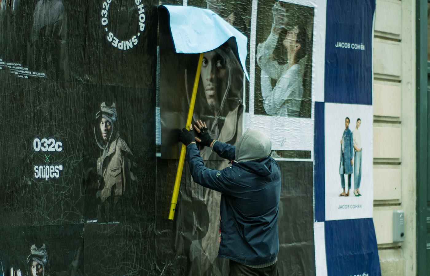 Wheatpaste poster installation by street teams in Chicago